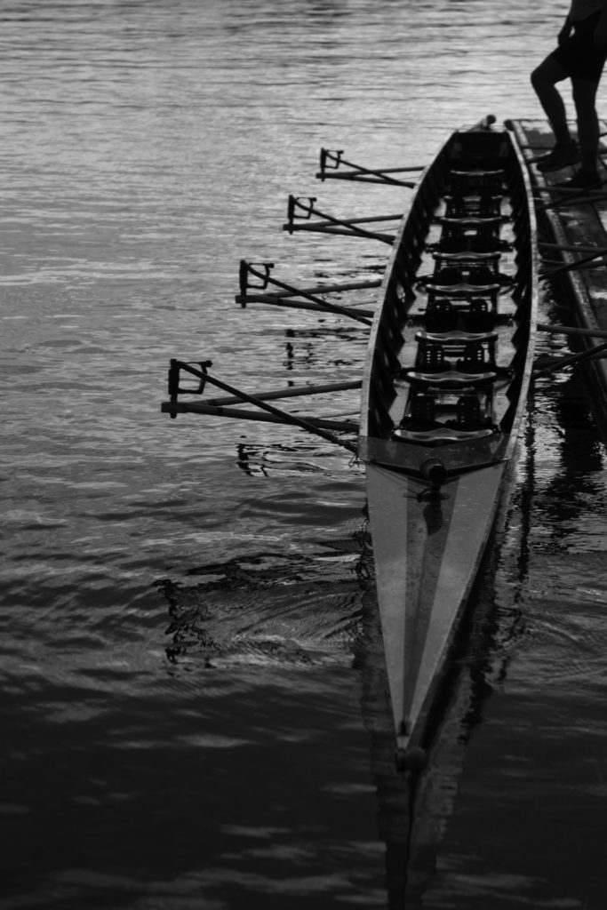 Row boat on water in black-and-white